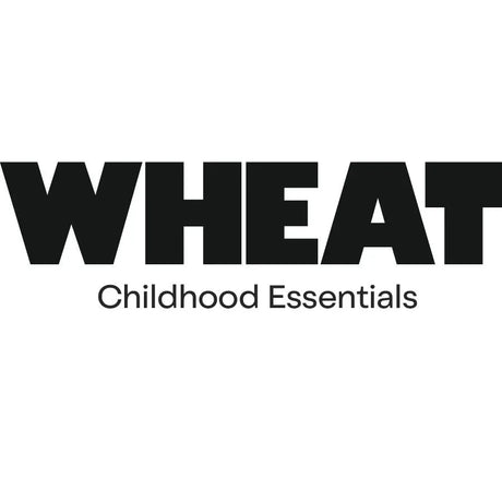 WHEAT Logo mit Text 'Childhood Essentials' auf weißem Hintergrund, Kinder Concept Store
